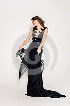 Individuality. Thoughtful Elegant Lady in Black Prom Evening Dress.