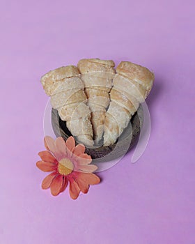 In Indonesia, this cake is known as cumcum cake. A cake shaped like a trumpet, or an ice cream cone.