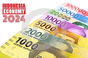 Indonesia economy 2024 text with all nominal rupiah money currency on eh background