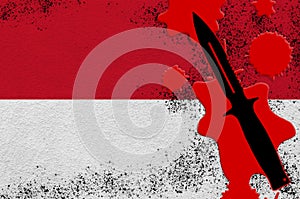 Indonesia flag and black tactical knife in red blood. Concept for terror attack or military operations with lethal outcome