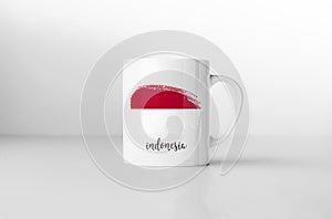 Indonesia flag on white coffee mug.