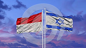 Indonesia and Israel two flags on flagpoles and blue cloudy sky.