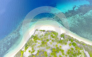 Aerial Isolated island, tropical island with blue transparent water photo