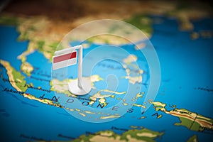 Indonesia marked with a flag on the map