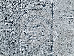 Stack of hebel concrete blocks with visible SNI logo, captured in black and white.