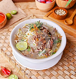 Indonesian Beef Soto Soup with Lime and Herbs photo