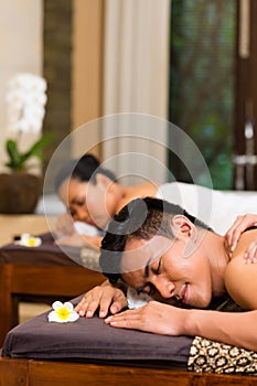 Indonesian couple having wellness massage