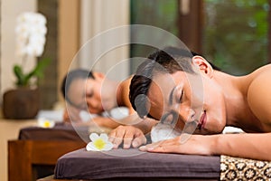 Indonesian couple having wellness massage photo