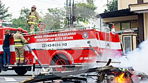 An Indonesian firefighter is carrying out his duties professionally