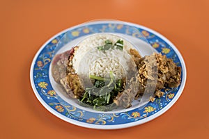 Indonesian food cuisine called ` Nasi Ayam Penyet `