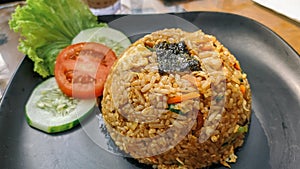 Indonesian Food Fried Rice with Tomato and Lettuce pieces is the most delicious food in the world according to CNN photo