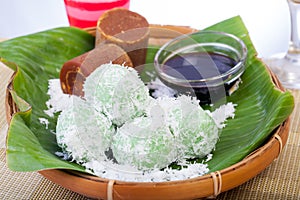 Indonesian Food Klepon with coconut on banana leaf