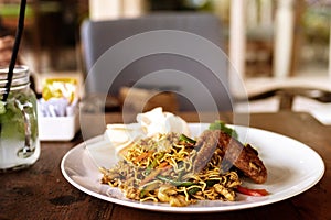 Indonesian food, mie goreng ayam, fried noodles with chicken. Bali, Indonesia.