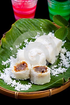 Indonesian Food Putu with coconut on banana leaf