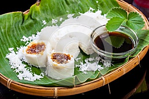 Indonesian Food Putu with coconut on banana leaf