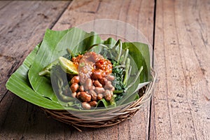 Indonesian green salad on wood table photo