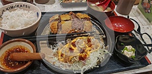 Indonesian japanese fusion food, japanese food cook in indonesian style, gyukatsu, beef karage, salad, and tofu soup