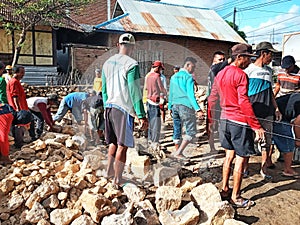 Indonesian local people working together building neighbor's house, Asian male construction workers and labor day