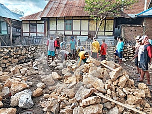 Indonesian local people working together building neighbor's house, Asian male construction workers and labor day