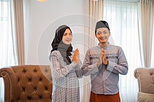 Indonesian Muslim couple gestures to congratulate Eid