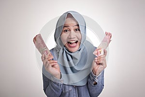 Indonesian Muslim Woman Holding Rupiah Money