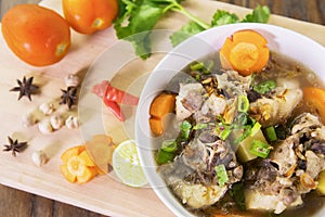 Indonesian oxtail soup on table