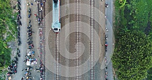Indonesian passenger train KAI traveling on the rail from aerial view