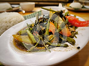 An Indonesian restaurant dish called cah kangkung photo