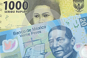 An Indonesian rupiah bank note with a twenty peso bill from Mexico