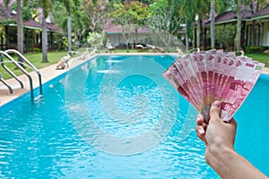 Indonesian rupiah in the hands on Bali, Indonesia