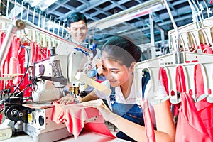 Indonesian Seamstress in Asian textile factory