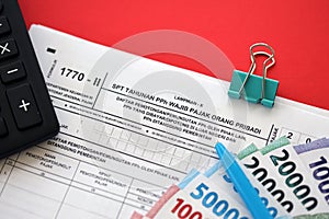 Indonesian tax form 1770-2 Individual Income Tax Return and pen on table