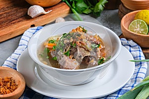 Indonesian traditional culinary, called sop buntut or oxtail soup photo