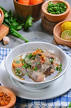 Indonesian traditional culinary, called sop buntut or oxtail soup photo