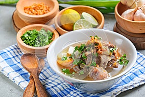 Indonesian traditional culinary, called sop buntut or oxtail soup photo