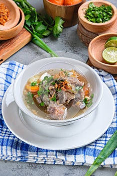 Indonesian traditional culinary, called sop buntut or oxtail soup photo