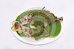 Indonesian traditional food named "ikan kuwe bakar cabai hijau"