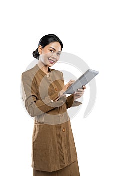 Indonesian woman in civil servant uniform with thumbs up while using tablet