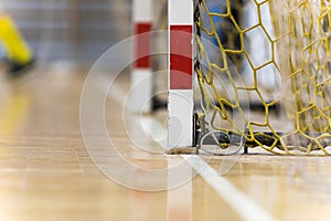 Indoor Football Goal With Yellow Net. Red and White Soccer Goal Post. Futsal White Sideline photo