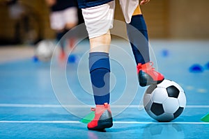 Indoor futsal soccer players playing futsal match. Indoor soccer sports hall