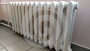 Indoor heating radiator. Cast iron radiators heat the room