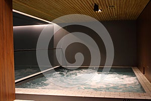 Indoor jacuzzi pool with boiling water at the spa center