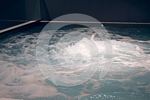 Indoor jacuzzi pool with boiling water at the spa center