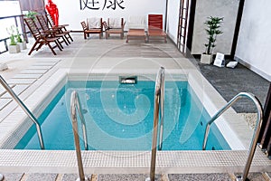Indoor modern swimming pool in hotel spa center. Beautiful pool in the spa center, rest, relaxation.