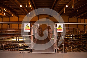 Indoor parts of small particle accelerator with radiation signs