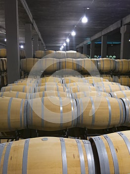 Indoor photo of wooden barrels in old winery