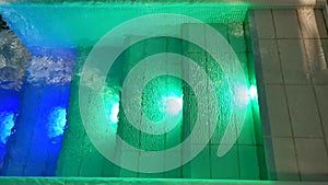 Indoor pool rippling water colorful lighted