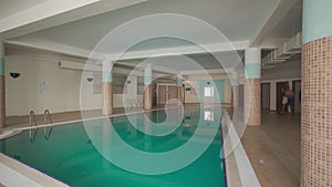 Indoor pool in spa center with transparent turquoise water for leisure, wellness, relaxing swim, therapy, hydrotherapy