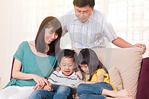 Indoor portrait of asian family