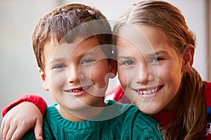 Indoor Portrait Of Brother And Sister